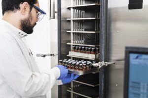 Man with lab bottles