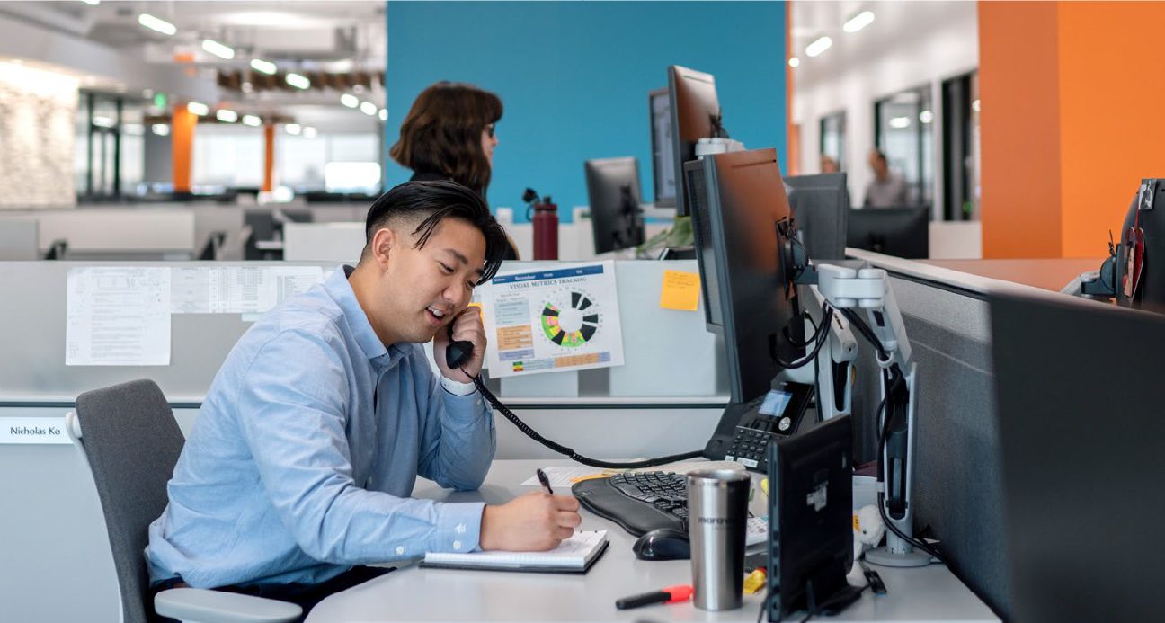 Man at his desk on the phone