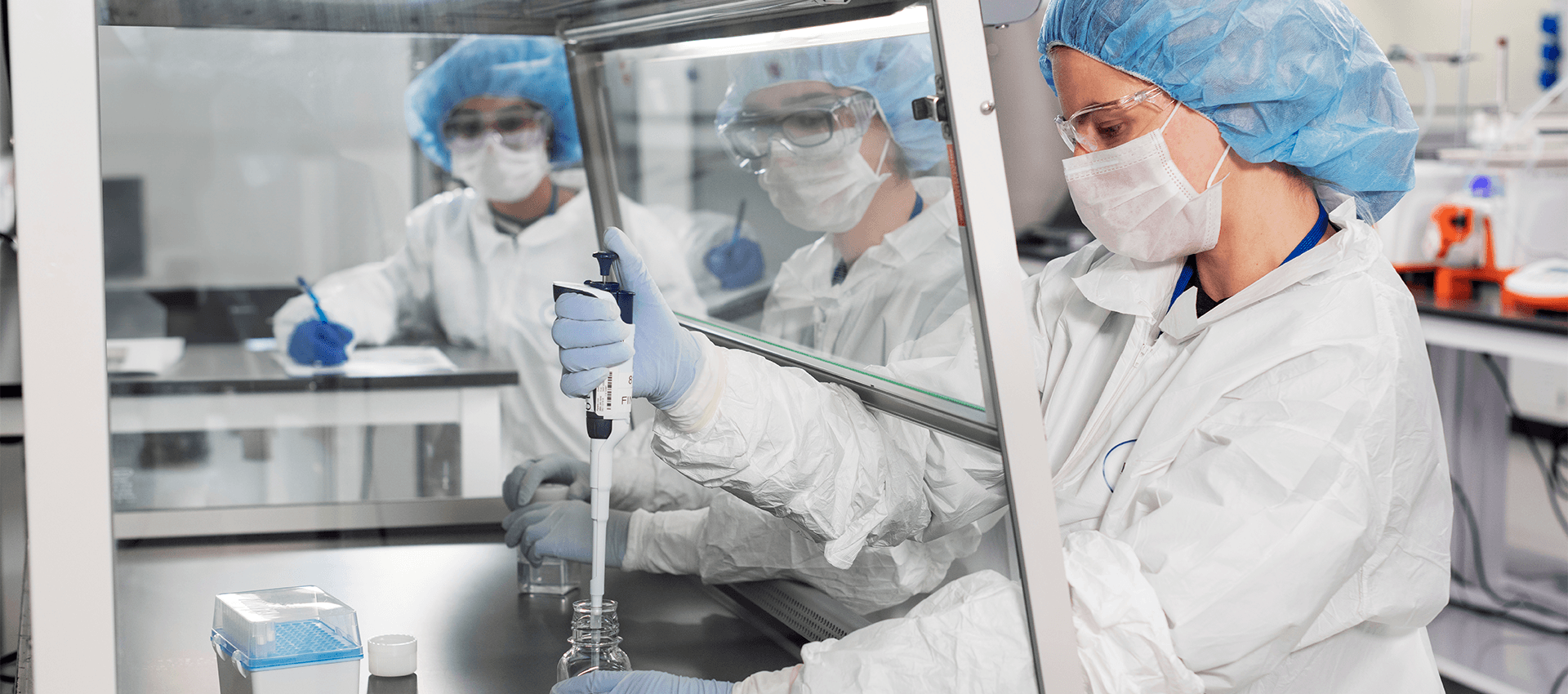 Scientist filling a jar