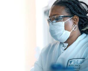 Lab scientist in safety gear